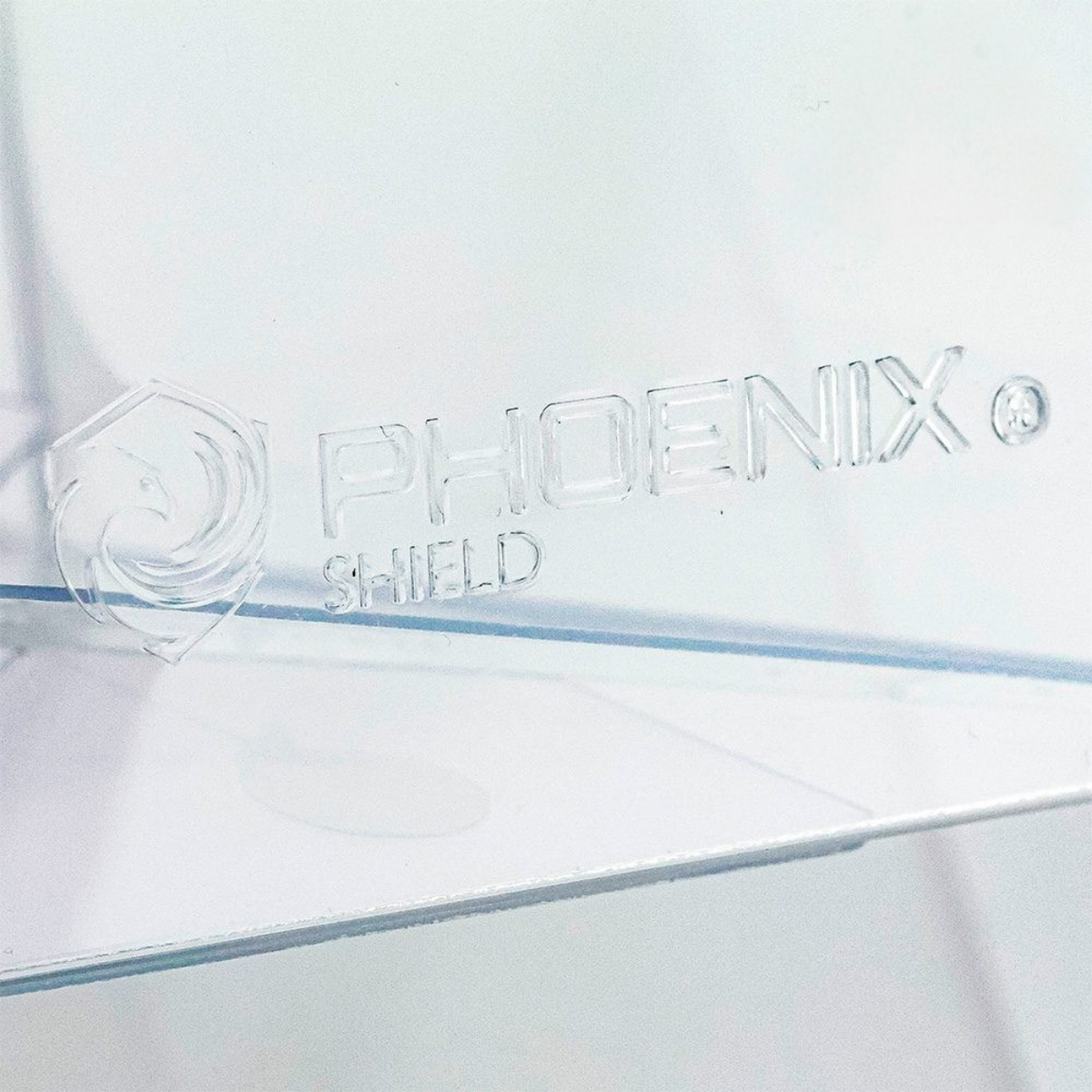 Gravure du logo Phoenix Shield sur la Crystal Box