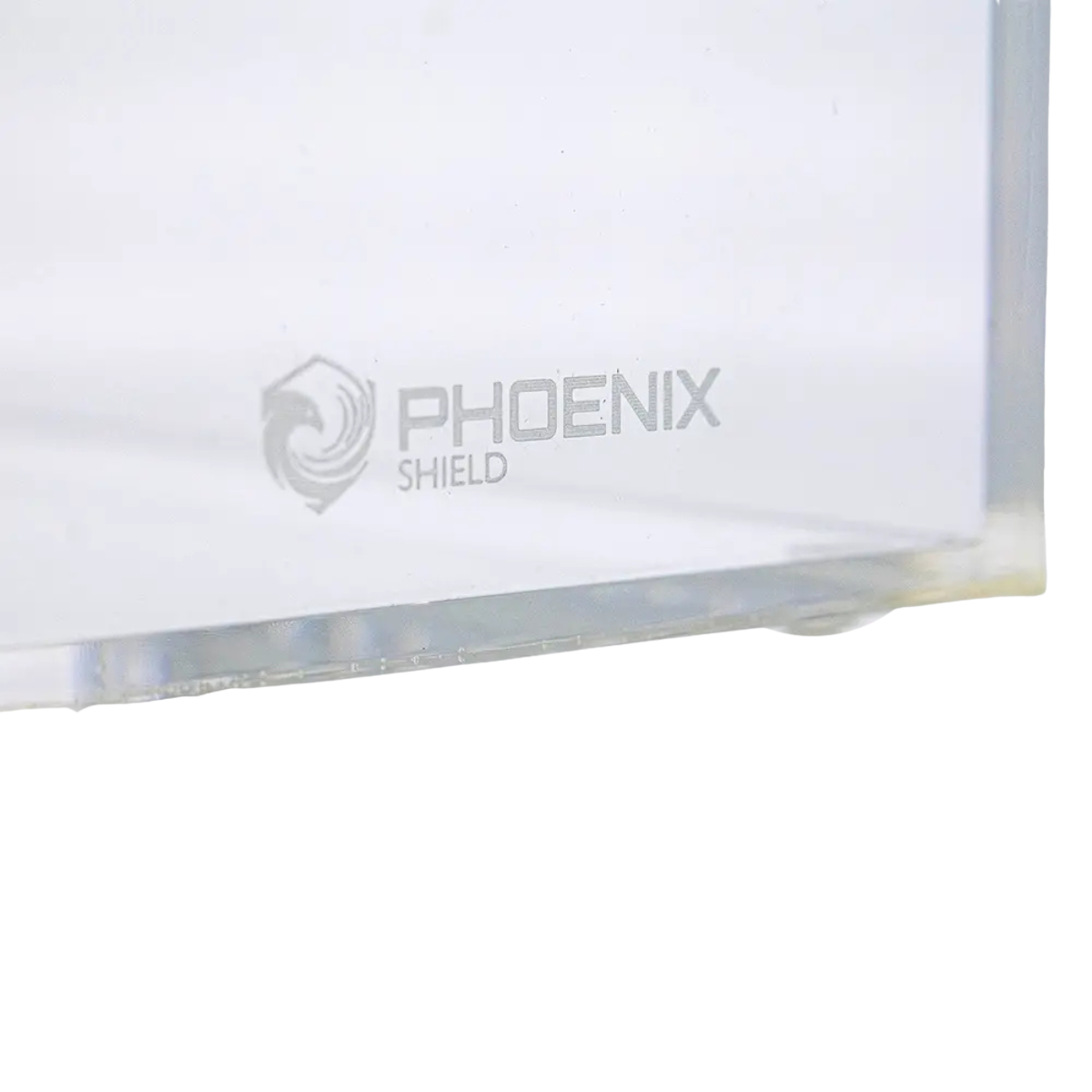 Gravure du logo Phoenix Shield dans l'angle du boîtier acrylique